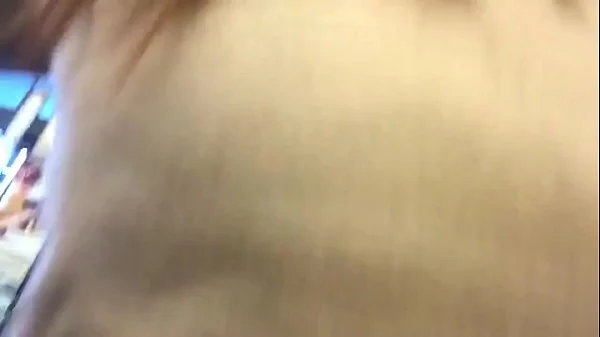 Cute Redhead shops for and uses cucumber