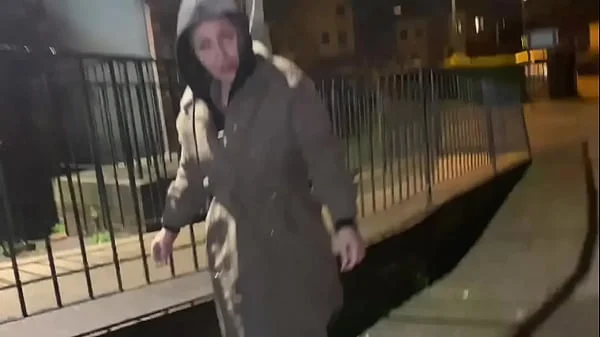 Woman on street gets offered a cigarette to flash and piss in public