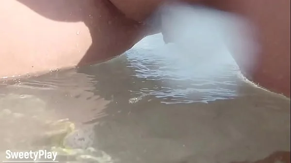 Shaved pussy peeing on public beach