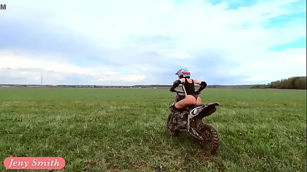 Naked woman riding a Dirt Bike