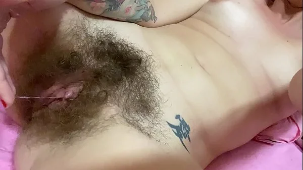 Super hairy pussy with huge clit masturbates and cums hard in close up