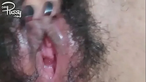 Extreme close-up hairy pussy masturbation